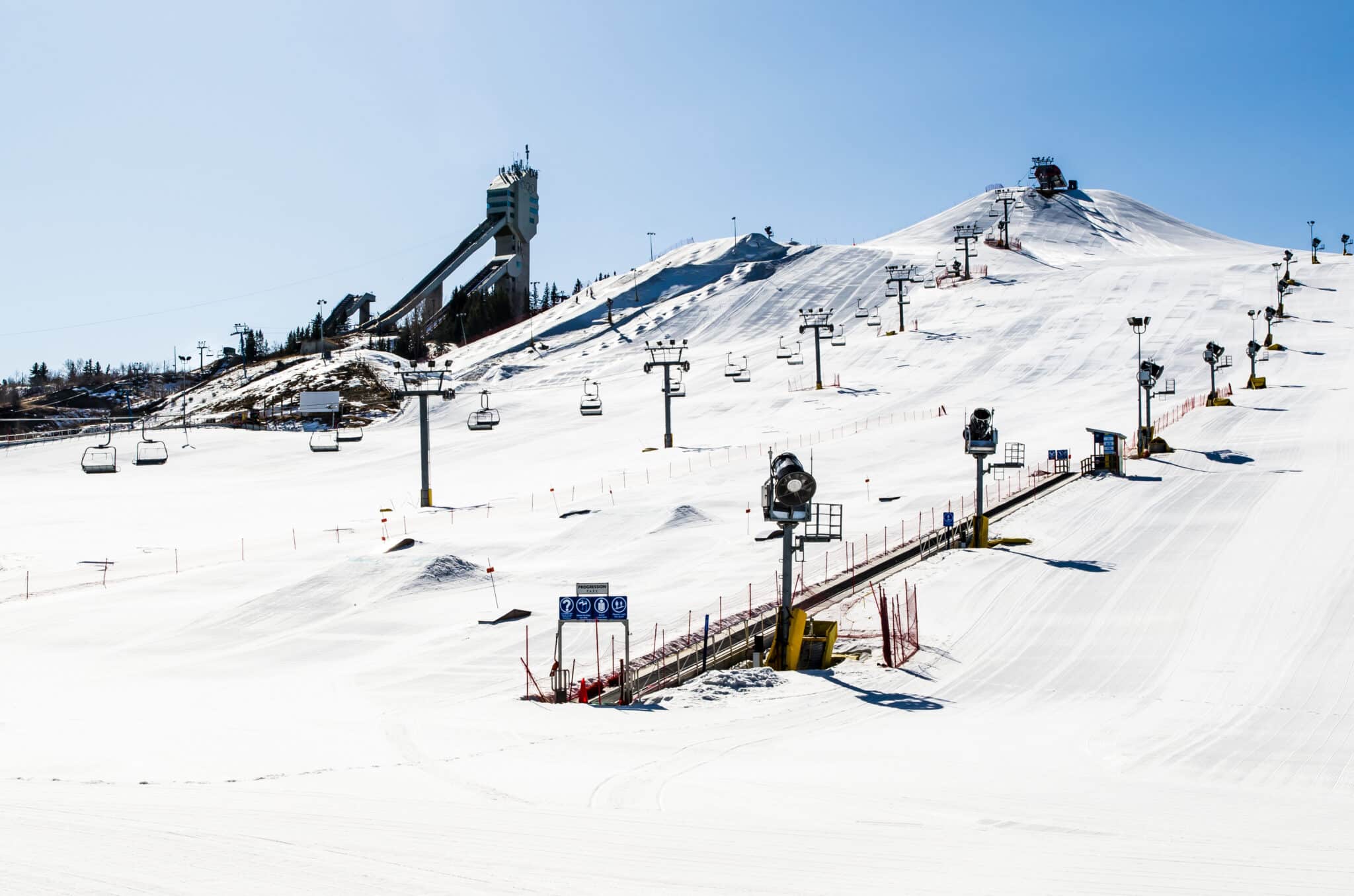 Calgary Olympic Park: ski jumping ramps, ski lift, carpet and snow making machines